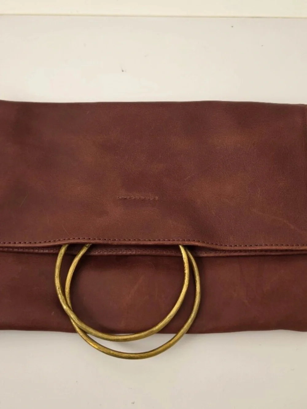 •Parker Clay • Nyala Fold over leather clutch rust